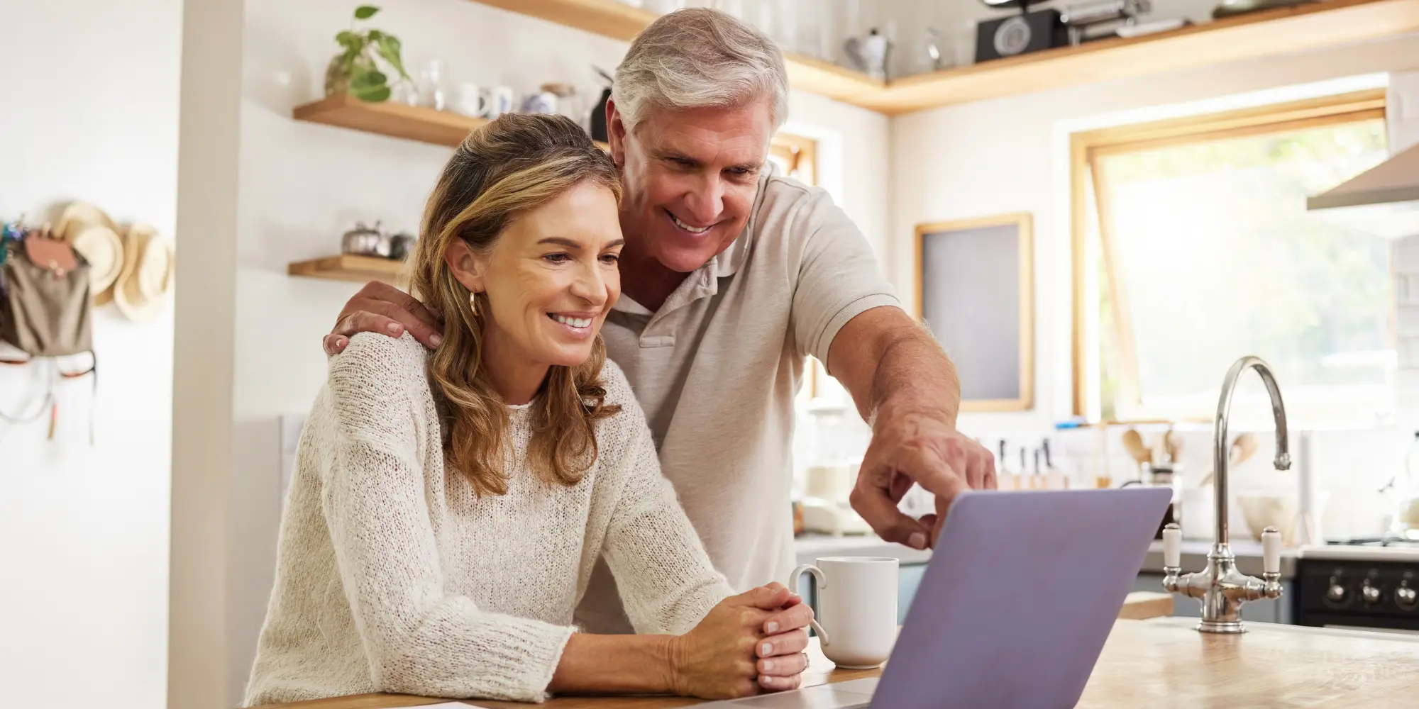 Happy pension couple doing retirement planning