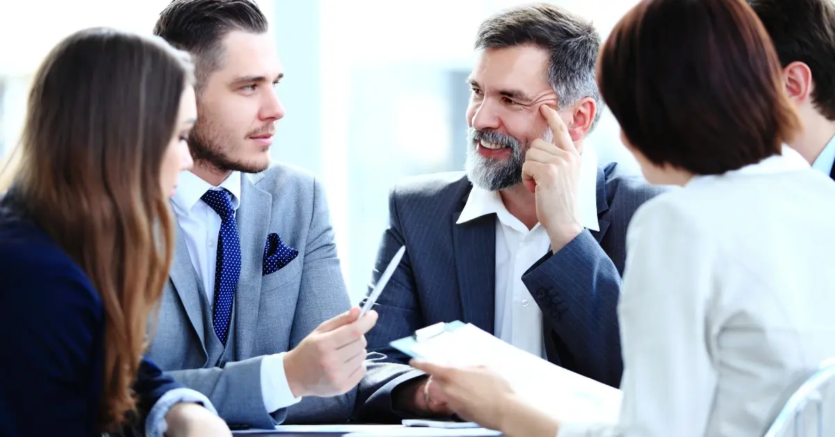 Professional group discussing director IDs