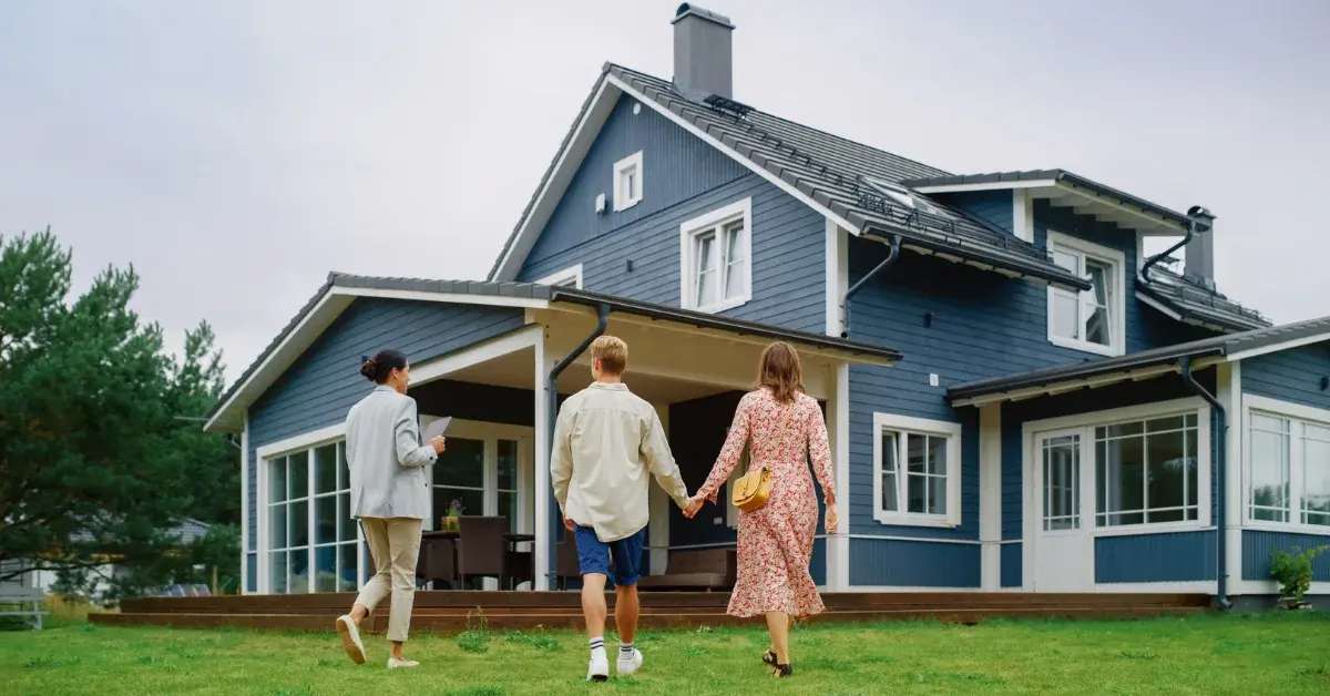 Couple with real estate agent purchasing property