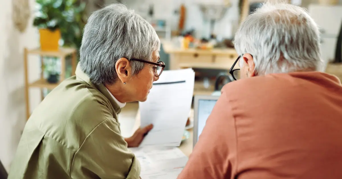Older couple looking at pension paperwork