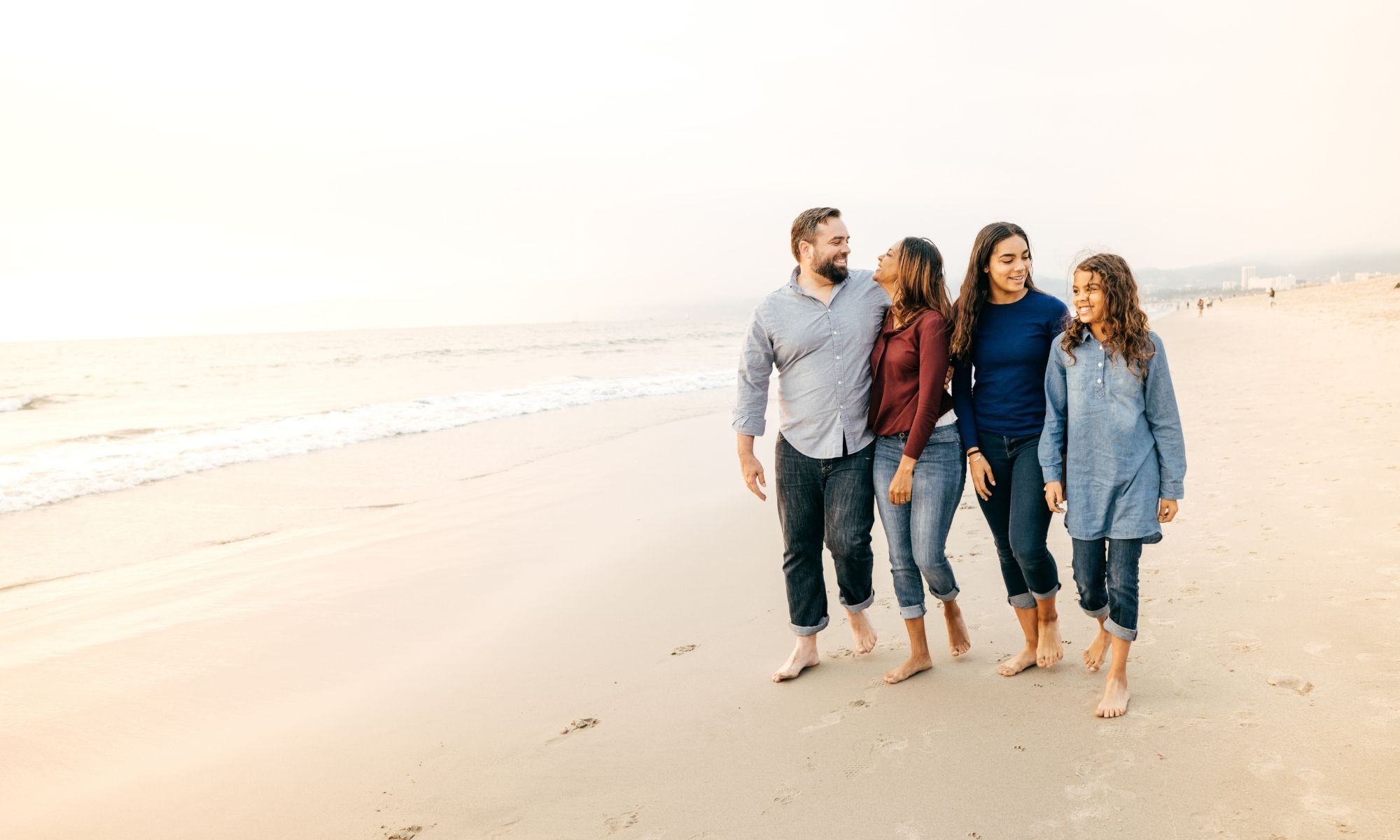 Family members walking along a beach